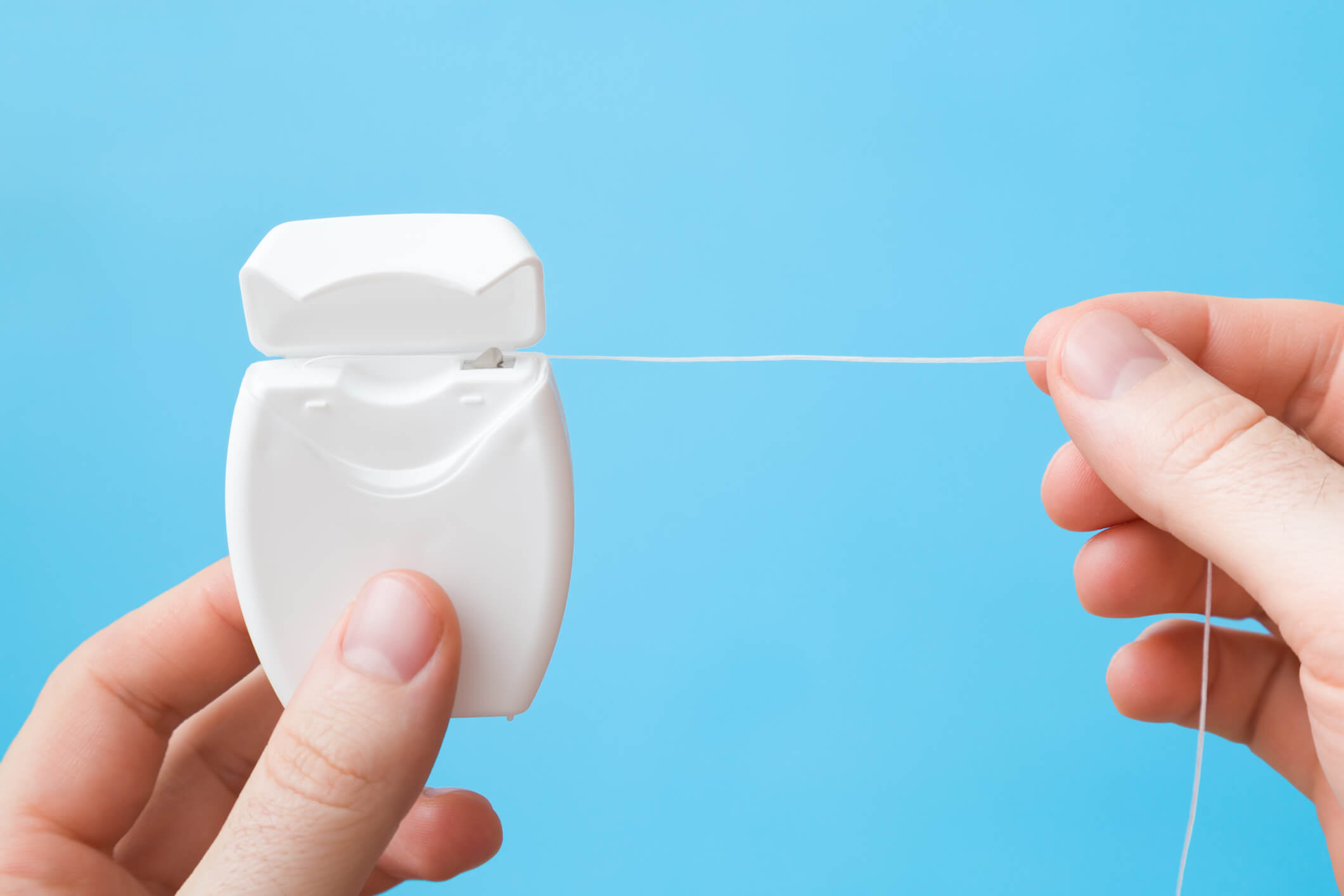 floss being pulled out