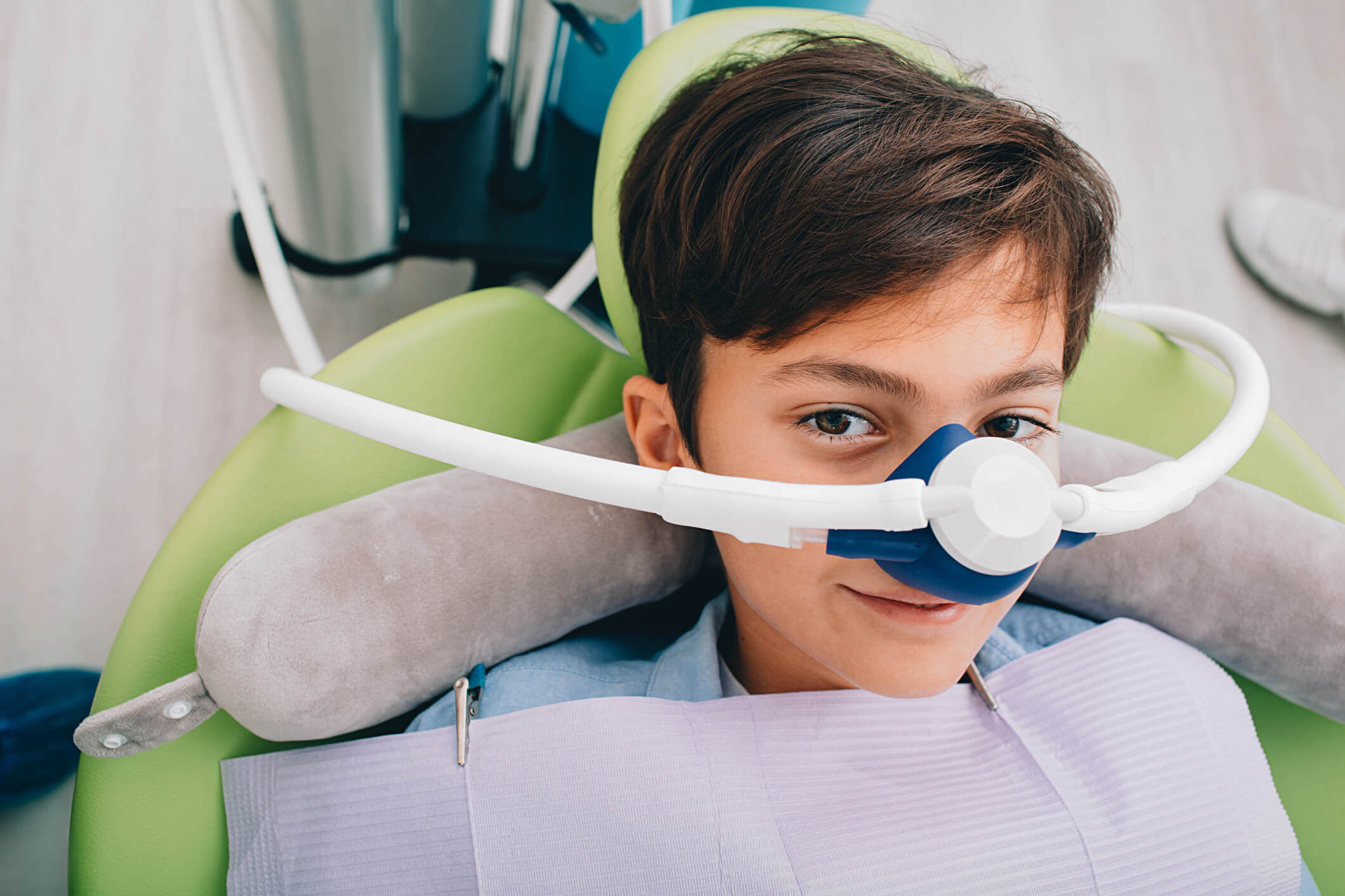 child with a mask on going under anesthesia