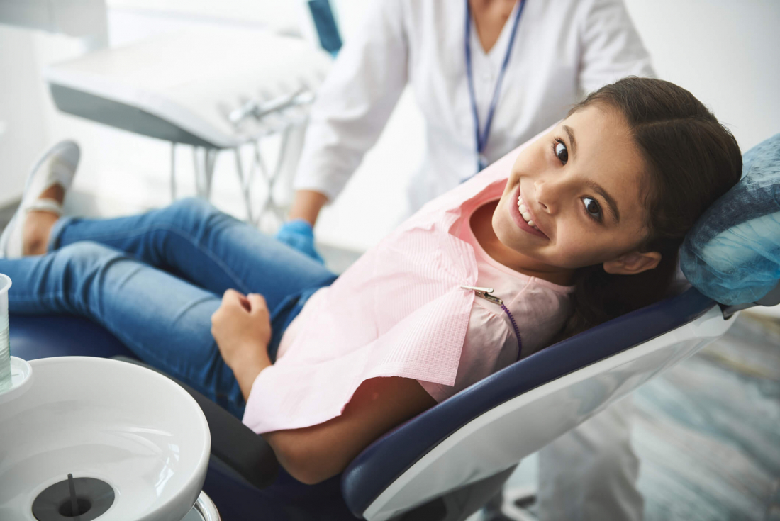 smiling child in dental chair