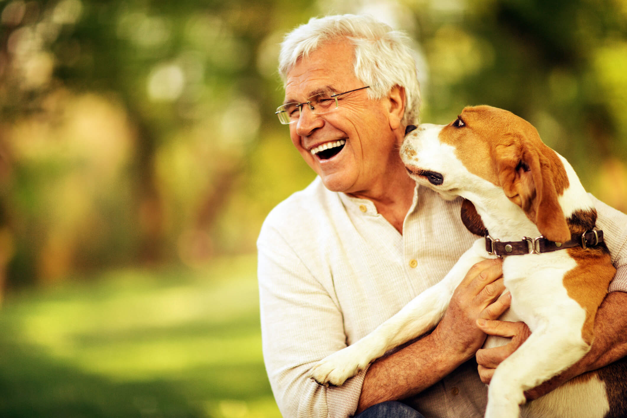 smiling senior man with dog