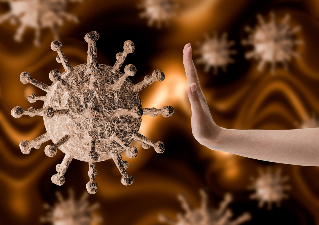 hand being held up to cartoon virus