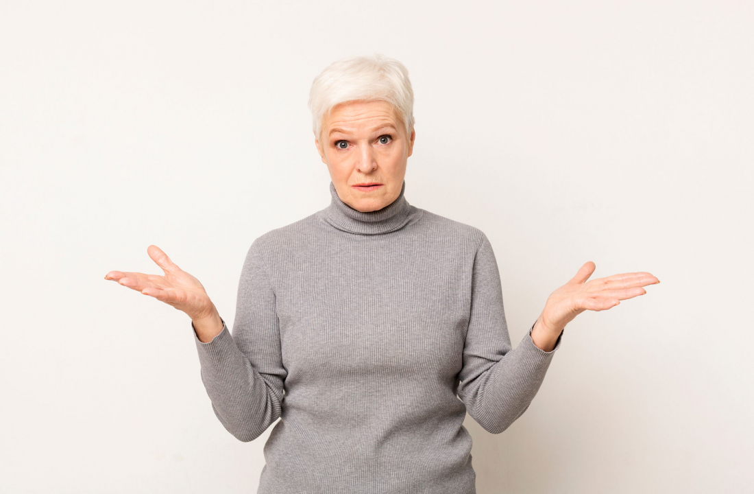 senior woman shrugging in confusion