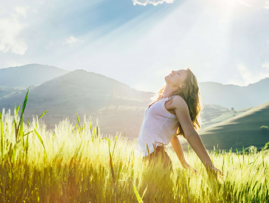 eyes close woman in sunny field