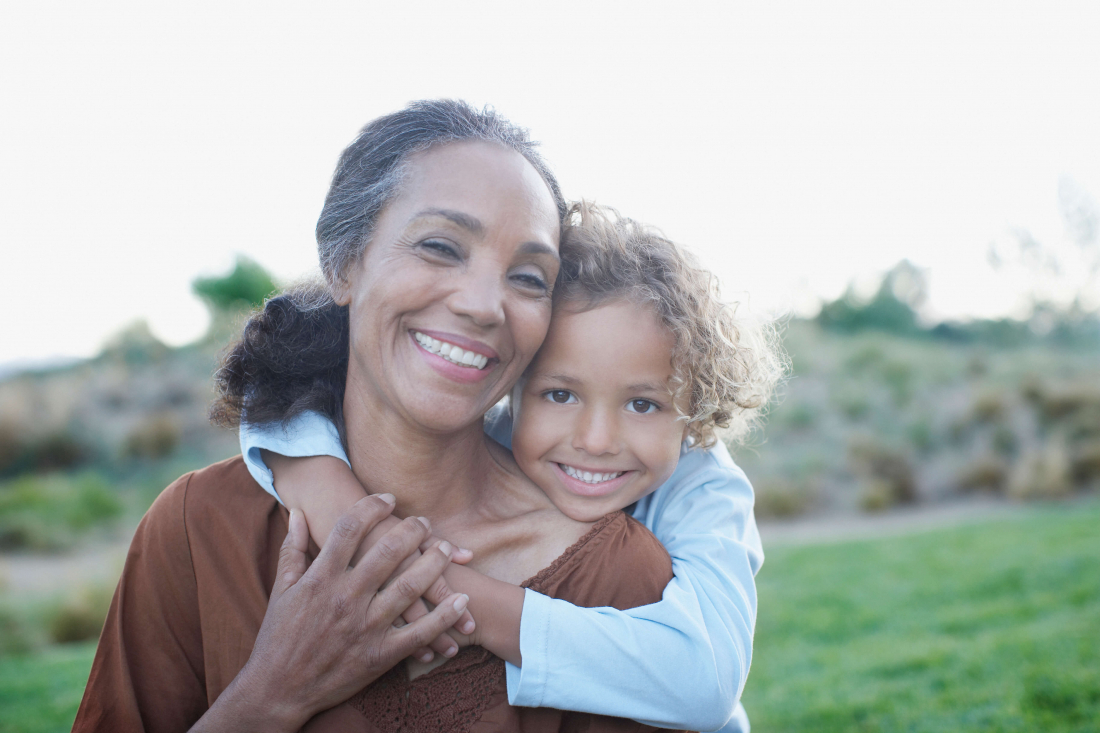 smiling woman with child