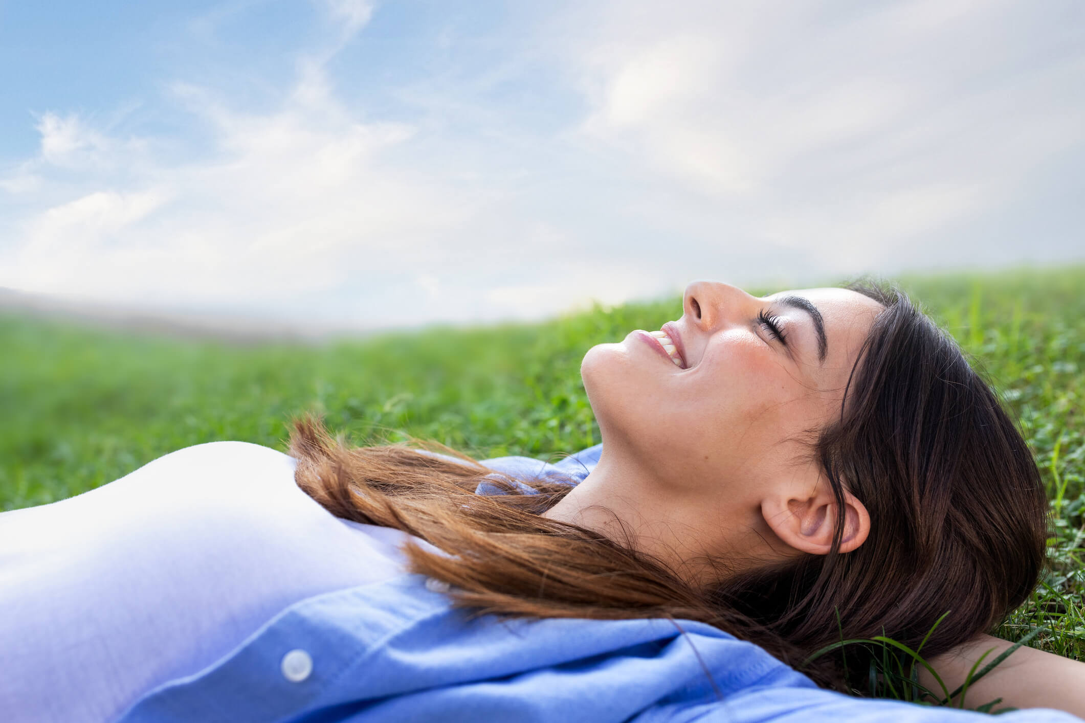 Photo of woman laying in grass
