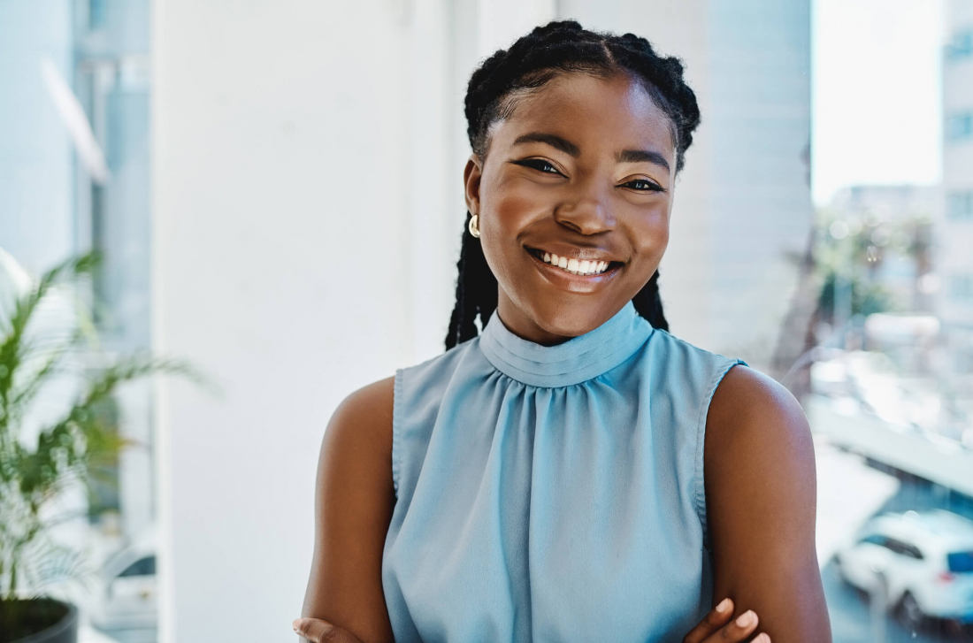 image of woman smiling in blue shirt