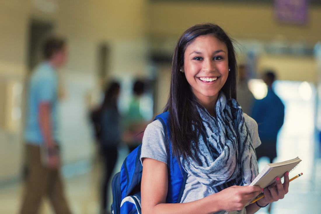 teen smiling after back-to-school dental checkup