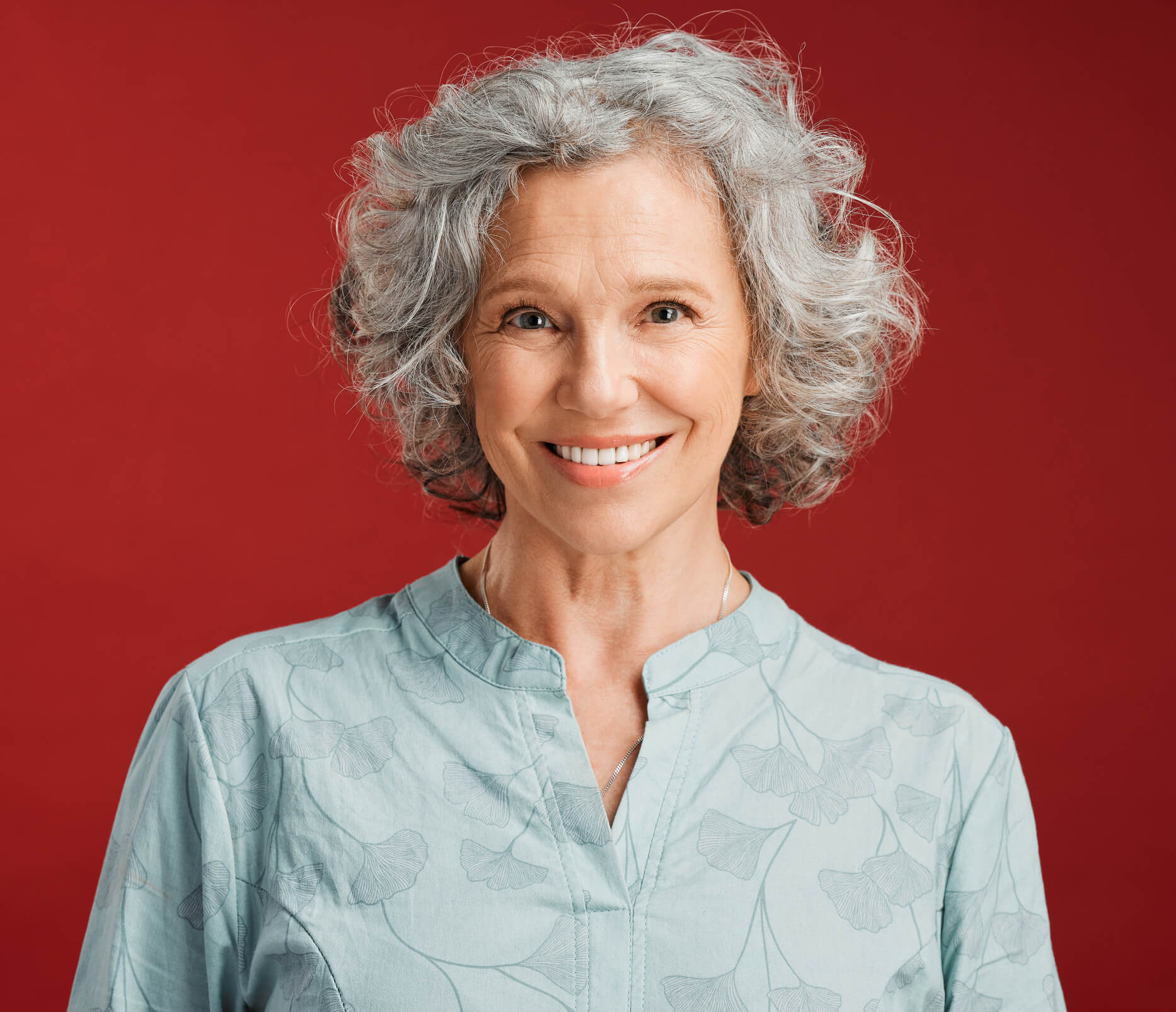 woman with gray hair smiling